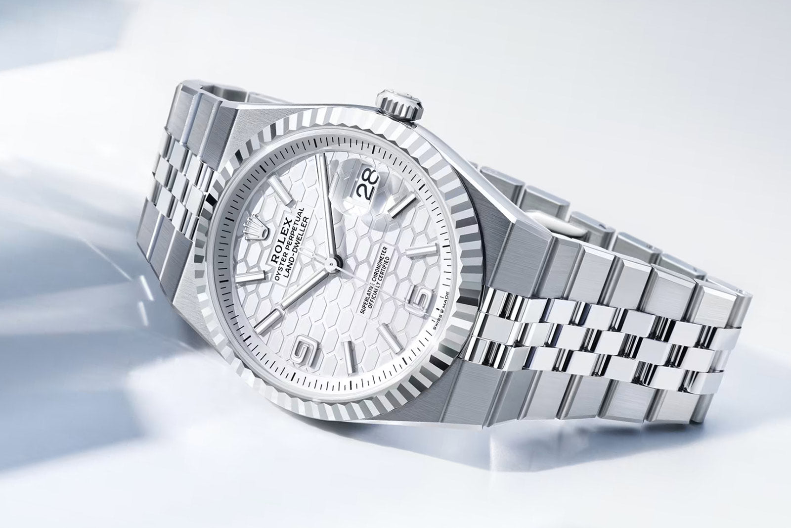 Rolex Land‑Dweller 40mm – White Gold & Stainless Steel – White Honeycomb Dial – Fluted Bezel – Flat Jubilee Bracelet - 127334 - 2025