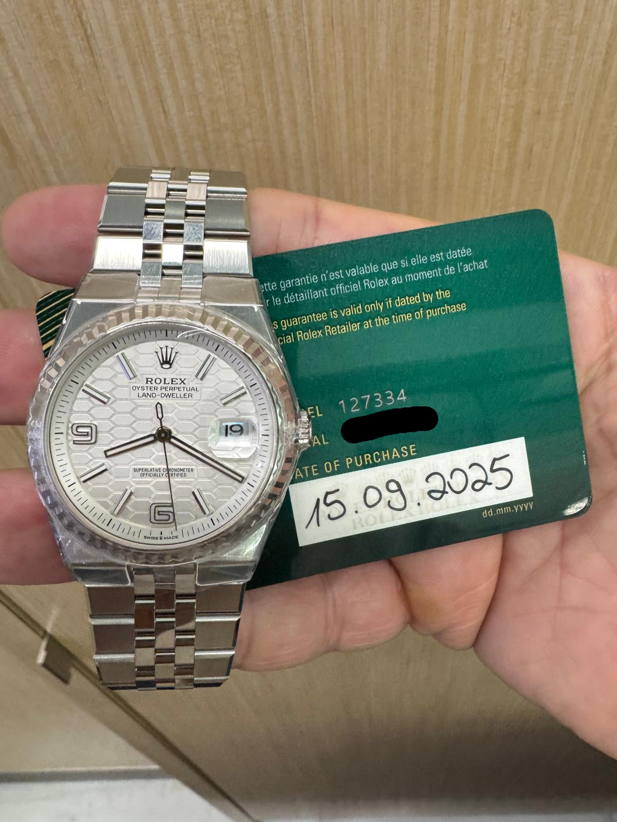 Rolex Land‑Dweller 40mm – White Gold & Stainless Steel – White Honeycomb Dial – Fluted Bezel – Flat Jubilee Bracelet - 127334 - 2025